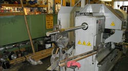 A shop-built system that supports extended bar stock, aiming to enhance the machine’s productivity by allowing higher volumes of material to be loaded. Allowing bar stock to be unsupported presents a potentially fatal workplace hazard. The author emphasized that employers who develop their own support systems should work with engineers or other specialists to ensure the system is functional and safe. A shop-built system that supports extended bar stock, aiming to enhance the machine’s productivity by allowing higher volumes of material to be loaded. Allowing bar stock to be unsupported presents a potentially fatal workplace hazard. The author emphasized that employers who develop their own support systems should work with engineers or other specialists to ensure the system is functional and safe.