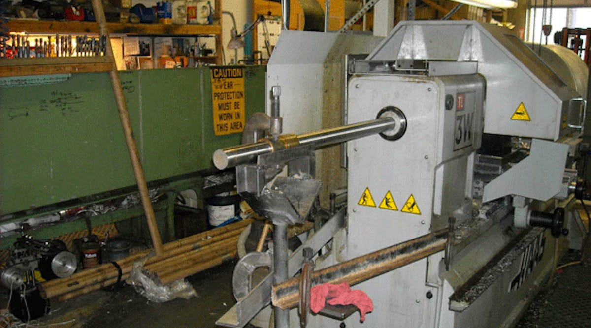 A shop-built system that supports extended bar stock, aiming to enhance the machine&rsquo;s productivity by allowing higher volumes of material to be loaded. Allowing bar stock to be unsupported presents a potentially fatal workplace hazard. The author emphasized that employers who develop their own support systems should work with engineers or other specialists to ensure the system is functional and safe.