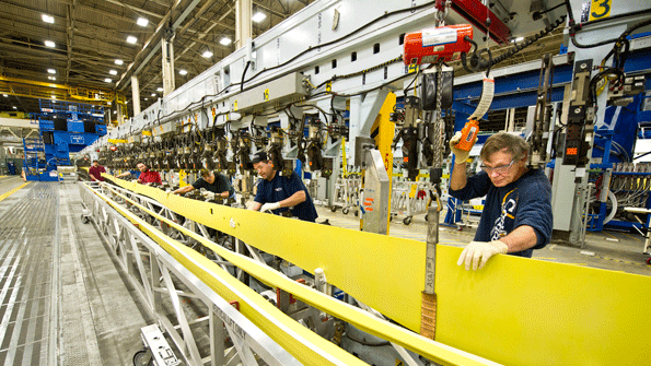 Boeing mechanics assembly spars for the NextGeneration 737 at the jetbuilderrsquos Renton Wash plant