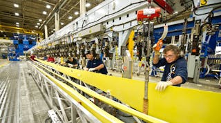 Boeing mechanics assembly spars for the Next-Generation 737 at the jet-builder&rsquo;s Renton, Wash. plant.