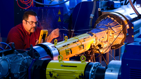 At the GM Powertrain Engineering Development Center in Pontiac Mich a technician monitors nonfueled loaded spin testing of a sixspeed transmission