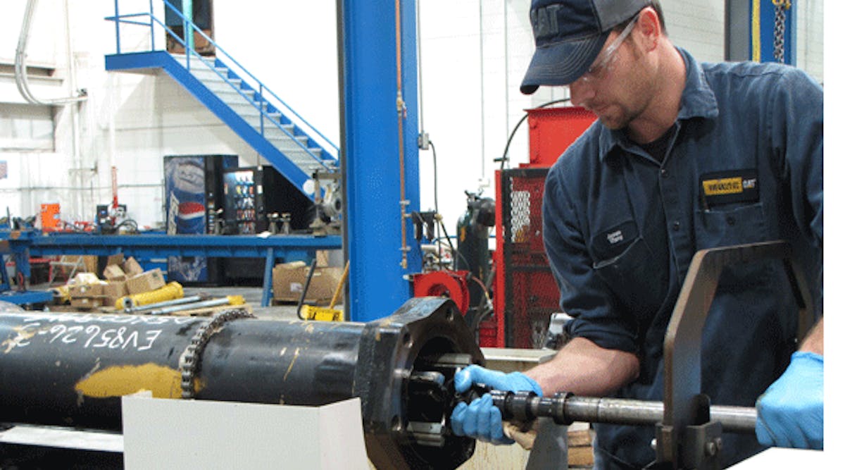 An operator inserts a tool in the honing machine at the start of a cycle. Whane Supply hones cylinders with bore IDs up to 17 in. The HTA tube-honing system supplied by Sunnen handles parts weighing up to 8,000 lb. (3,629 kg), with ID ranges from 2.5 to 21 in. (63.5 to 533 mm).
