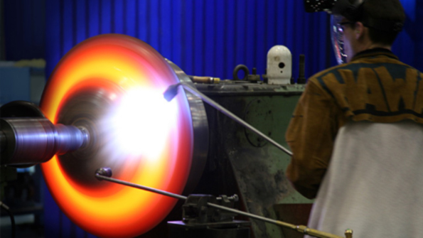 Metal spinning involves a disc revolving at controlled speeds on a lathelike machine with a spinning mandrel imparting the shape of the finished design The finished parts are able to be used in place of welded or fabricated shapes