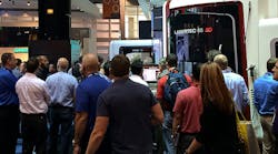The crowd lines up to catch a glimpse of DMG Mori&apos;s new hybrid machine, the Lasertec 65 3D.