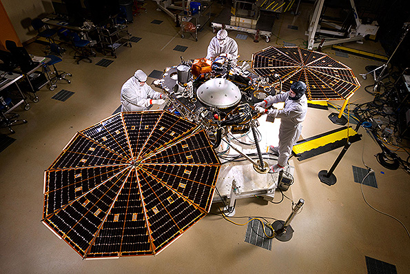 Lockheed Martin engineers and technicians are seen testing the deployment of the InSight landerrsquos solar arrays This configuration is how the spacecraft will look on the surface of Mars