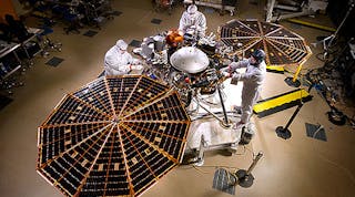 Lockheed Martin engineers and technicians are seen testing the deployment of the InSight lander&rsquo;s solar arrays. This configuration is how the spacecraft will look on the surface of Mars.