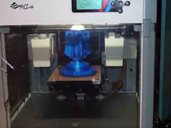 One of three XYZprinting DaVinci 3D printers at Royal Machine producing a workholding fixture model in preparation for final manufacturing