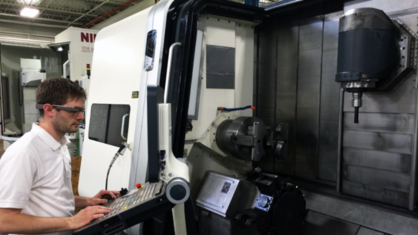 Indiana Gearrsquos Joel Neidig using the MTConnect Glassware app on the shop floor at Indiana Gear