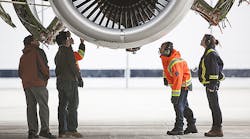Employees at Pratt &amp; Whitney&rsquo;s Mirabel Flight Test Center in Quebec inspect the PurePower Geared Turbofan PW1900G engine as it runs in preparation for its inaugural flight.