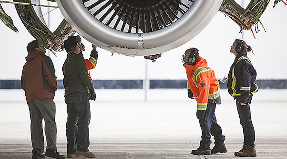 Employees at Pratt &amp; Whitney&rsquo;s Mirabel Flight Test Center in Quebec inspect the PurePower Geared Turbofan PW1900G engine as it runs in preparation for its inaugural flight.