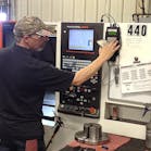 GEM Manufacturing&rsquo;s programmer Sean Svajcsik enters a down-time reason into the eNETDNC process-quality control application.