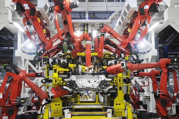 A Fiat 500 under assembly at the automakerrsquos plant in Pomigliano Italy where more than 600 Comau SpA robots help achieve a high degree of modularity and simplify maintenance