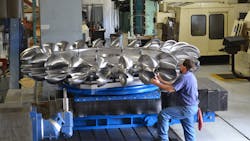 A hydropower ldquorunnerrdquo in process at Canyon Hydrorsquos automated CNC facility in Sumas Wash mdash a shop that runs 24 hoursday every day Completing one runner is a five axis job that takes months and produces one and a half ton of chips The bulk of machining is handled with standard 2inch indexable ball mills but critical undercuts are completed with a modified standard Ingersoll button mill that makes chips on the way in and also on the way out A hydropower ldquorunnerrdquo in process at Canyon Hydrorsquos automated CNC facility in Sumas Wash mdash a shop that runs 24 hoursday every day Completing one runner is a five axis job that takes months and produces one and a half ton of chips The bulk of machining is handled with standard 2inch indexable ball mills but critical undercuts are completed with a modified standard Ingersoll button mill that makes chips on the way in and also on the way out