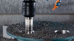 A close-up view of the hole-making process shows the Ingersoll Hi-Feed Deka face mill producing chips, partway through a complete hole. The tool withstands the lateral and impact forces associated with corkscrew milling, the developer noted, and because it has twice the diameter of the previous solid-carbide end mill it is less susceptible to deflection, and it leaves no slug. A close-up view of the hole-making process shows the Ingersoll Hi-Feed Deka face mill producing chips, partway through a complete hole. The tool withstands the lateral and impact forces associated with corkscrew milling, the developer noted, and because it has twice the diameter of the previous solid-carbide end mill it is less susceptible to deflection, and it leaves no slug.