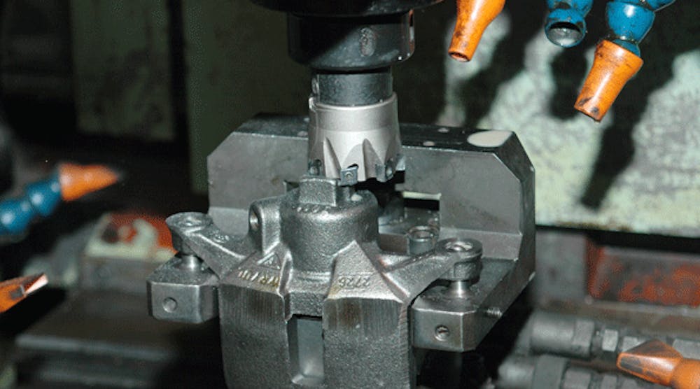 A tangential milling cutter takes a roughing cut at the Akebono automotive braking plant in Elizabethtown, Ky. Retooling boosted edge life by 18 to 1, and eliminated a vibration problem on the machine that formerly caused four to five unpredicted line stops per shift.
