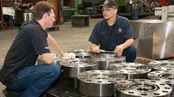 AWC Frac Valversquos finished valve bonnets get a closer inspection CNC lead man Ben Molinar and assistant manufacturing engineer Jim Beaver AWC Frac Valversquos finished valve bonnets get a closer inspection CNC lead man Ben Molinar and assistant manufacturing engineer Jim Beaver