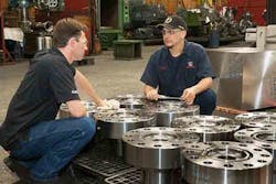 AWC Frac Valversquos finished valve bonnets get a closer inspection CNC lead man Ben Molinar and assistant manufacturing engineer Jim Beaver AWC Frac Valversquos finished valve bonnets get a closer inspection CNC lead man Ben Molinar and assistant manufacturing engineer Jim Beaver