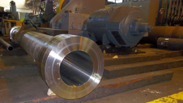 This 316 stainless steel cylinder is 144 in long with a bore size of 85 in and with a main section wall thickness of 15 in The part was finish bored honed and machined at American Hollow Boring Co with total indicator runout under 0010 in in the bore With the bore complete all other finished features were made according to the drawing