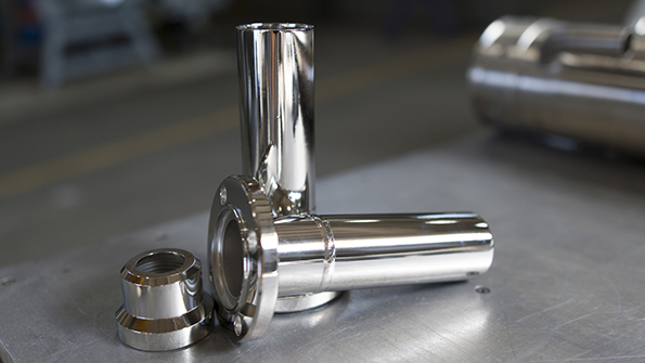 Electropolishing removes the outer surface skin of a component by positively charging the part and submerging it in an electrolytic bath to pull ions off the surface