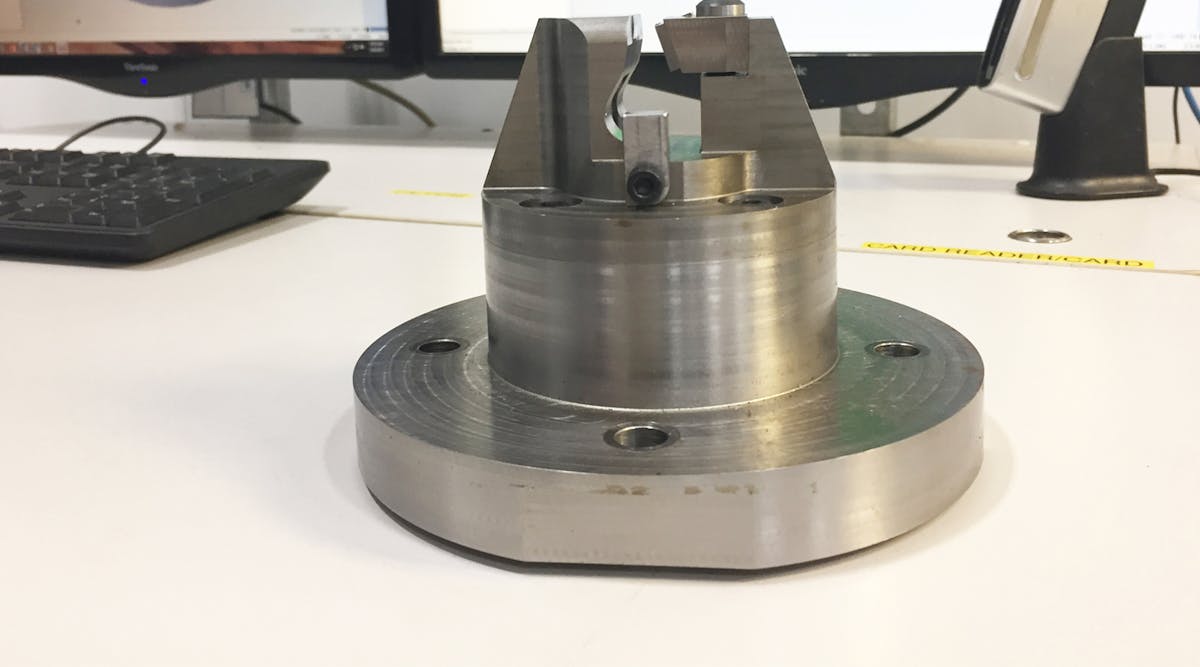 A custom fixture machined by Winsert to support five-axis machining of a part that requires very high tolerances and experiences high tool forces during machining.