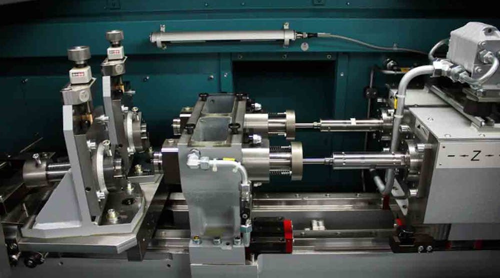 A view into a TBT two-spindle ML200 for drilling workpiece shanks. From left to right: Device, drill bush carrier with immersion sleeves, spindle head. For drilling depths &gt;200 mm, the user retrofits the drill bush carrier to the sealing case process. In this case, a steady can be mounted as well.