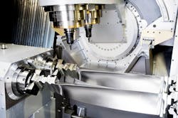 The Turbomill 1400 g uses its large size, weight, and rigidity to counter the forces generated by the 1-g acceleration/deceleration rates it achieves through three-dimensional machining. The Turbomill 1400 g uses its large size, weight, and rigidity to counter the forces generated by the 1-g acceleration/deceleration rates it achieves through three-dimensional machining.