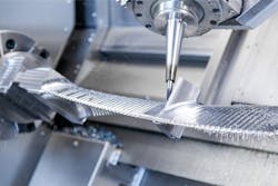 Five-axis machining is planned precisely to ensure smooth production of turbine blades.