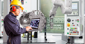 Engineer using laptop computer control automatic robotic hand with CNC machine in automotive industry, Smart factory concept.