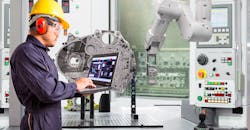 Engineer using laptop computer control automatic robotic hand with CNC machine in automotive industry, Smart factory concept. Engineer using laptop computer control automatic robotic hand with CNC machine in automotive industry, Smart factory concept.