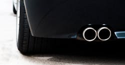 Dual tailpipe on a sports car. Dual tailpipe on a sports car.
