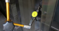 A dial gauge is used to check the level on a CNC machine. A dial gauge is used to check the level on a CNC machine.