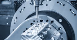 5-axis CNC milling machine cutting an aluminum V8 engine block using solid ball endmill tool. 5-axis CNC milling machine cutting an aluminum V8 engine block using solid ball endmill tool.