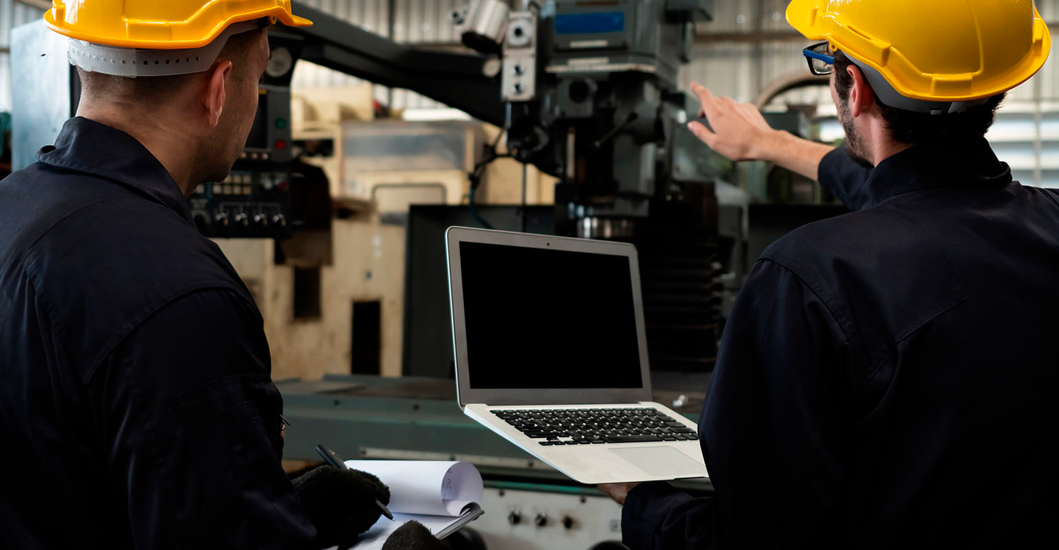 Worker with laptop computer to do procedure checklist.