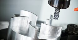 CNC milling machine in action. CNC milling machine in action.