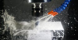 CNC milling process, with coolant. CNC milling process, with coolant.