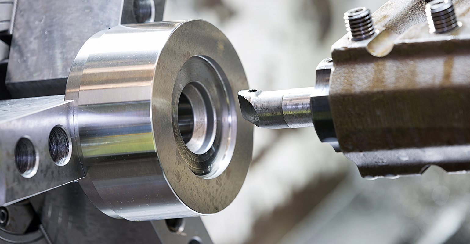 Machining a mold/die part by CNC turning.