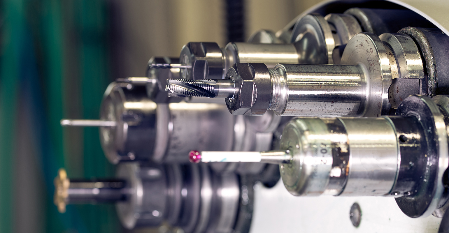 Cutting tools in position on a CNC turret.