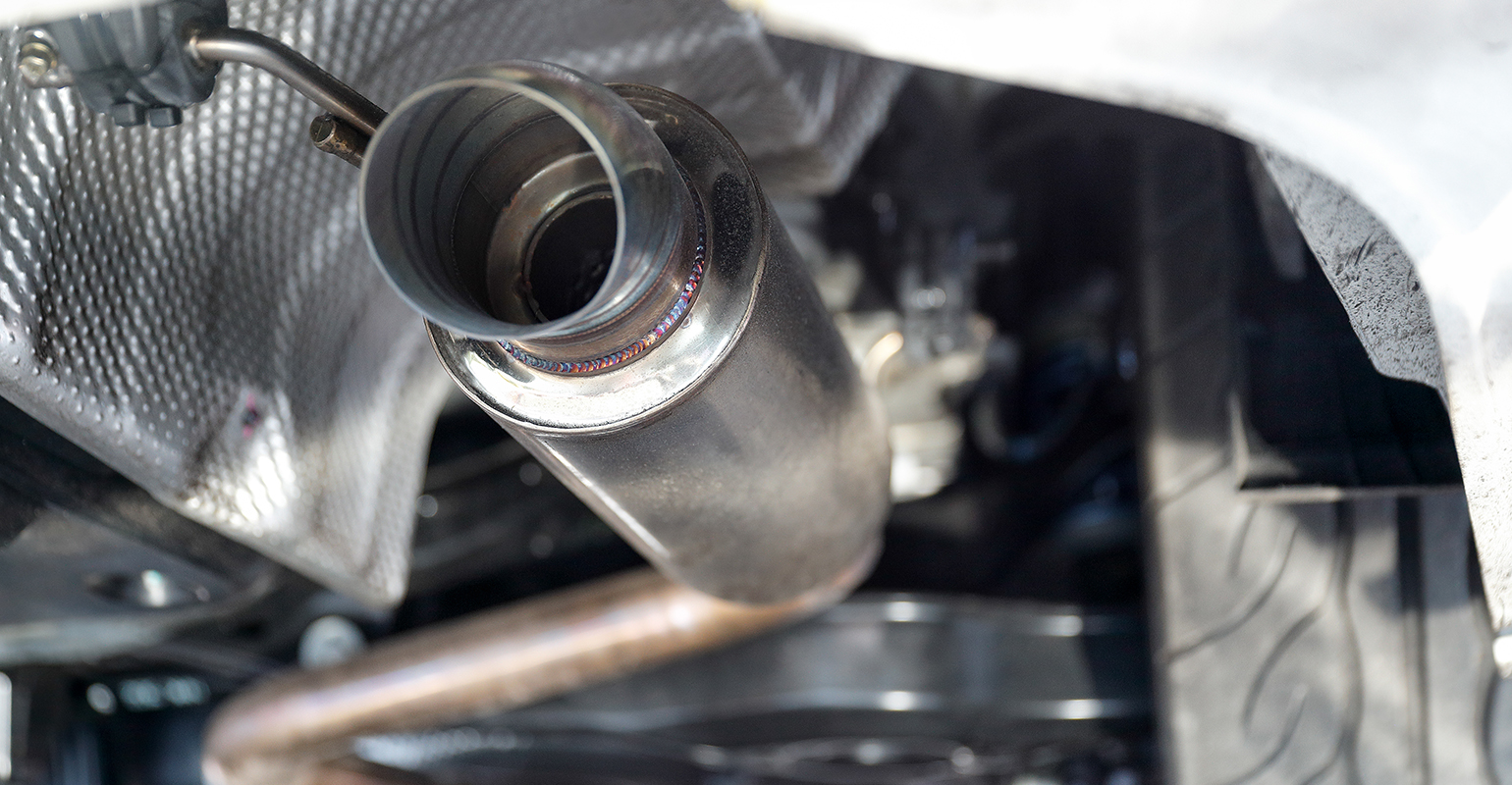 Auto exhaust/tailpipe close-up.