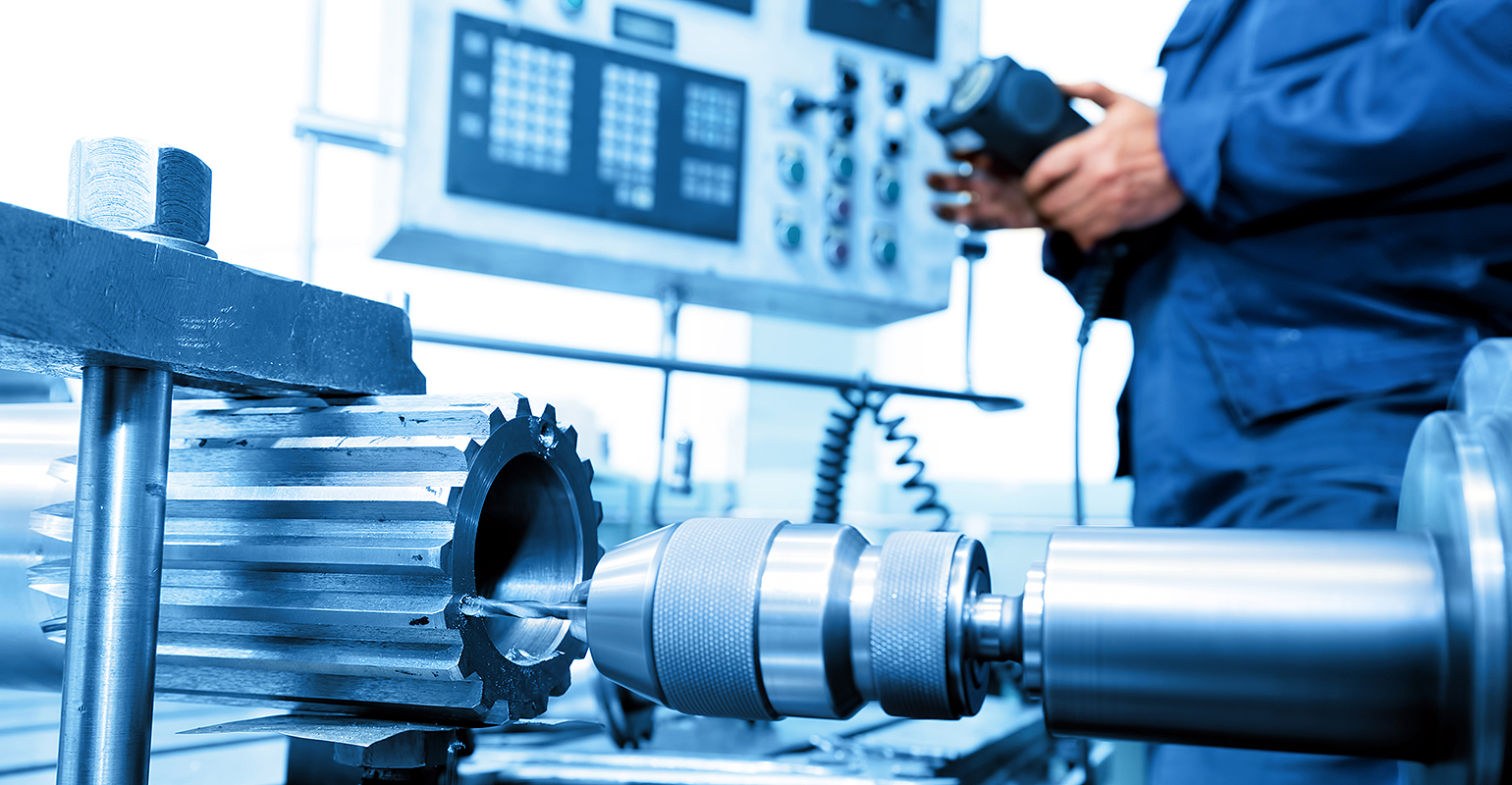 CNC machine and operator.