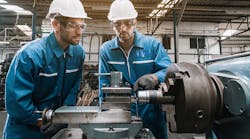 Engineering team checking machine safety. Engineering team checking machine safety.