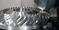 Machining a gear on a CNC machine tool. Machining a gear on a CNC machine tool.