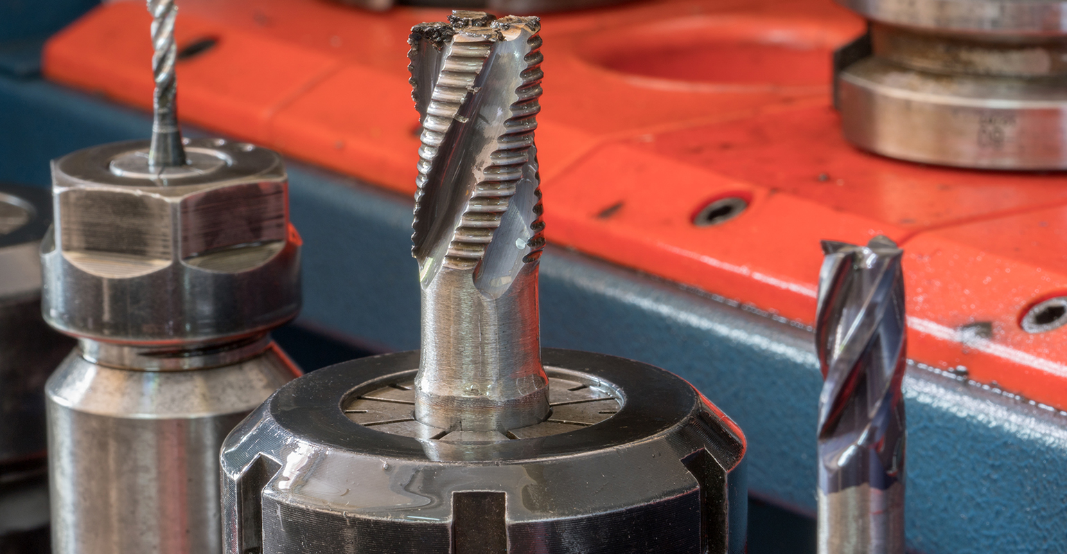 CNC milling machine with carbide end mills.