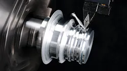 The VBGT-AL insert finish profiling an N1 aluminum cylindrical bar.