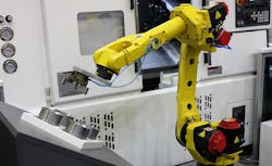 Robot tending a horizontal CNC machine. Robot tending a horizontal CNC machine.