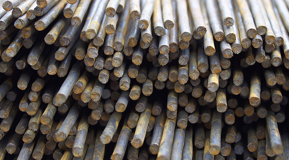 Steel reinforcing bars stored in a warehouse.