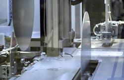 The interior of the DXSG320 wafer grinder showing two wafers in position for grinding. The interior of the DXSG320 wafer grinder showing two wafers in position for grinding.