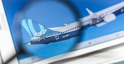 Boeing website, 737 MAX, under magnifying glass. Boeing website, 737 MAX, under magnifying glass.