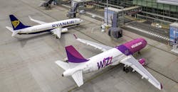 Airbus A320 and Boeing 737 aircraft at Wroclaw Airport, Poland. Aerial airplane photo taken by drone. Airbus A320 and Boeing 737 aircraft at Wroclaw Airport, Poland. Aerial airplane photo taken by drone.