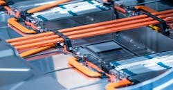 EV battery installed, showing wiring, sensors, connections. EV battery installed, showing wiring, sensors, connections.