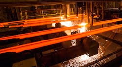 Steel billets, torch cutting at the run-out stage of continuous casting.